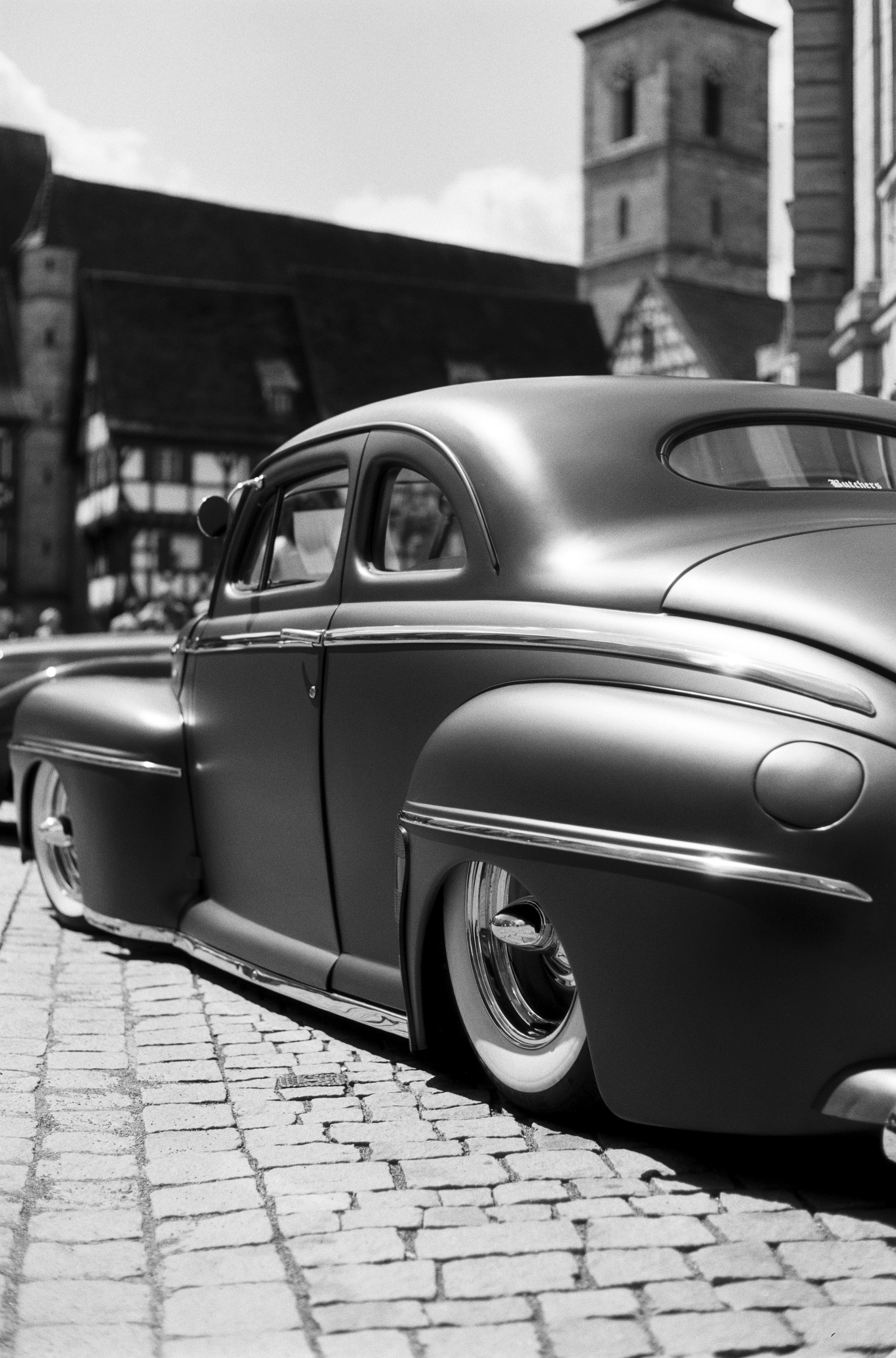 grayscale photography of vehicle